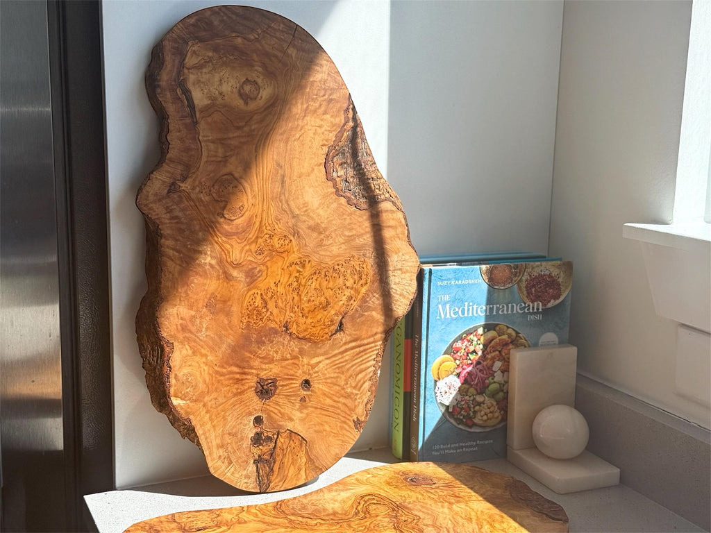 Our collection of handmade olive wood charcuterie boards showcases a beautiful variety of organic shapes. Each piece is uniquely carved to follow the natural contours of the olive wood, resulting in boards with flowing lines, gentle curves, and often wonderfully irregular edges. You&#39;ll find boards with elongated forms, wider surfaces, and some with charmingly asymmetrical silhouettes, ensuring a one-of-a-kind piece for your serving and decorative needs.