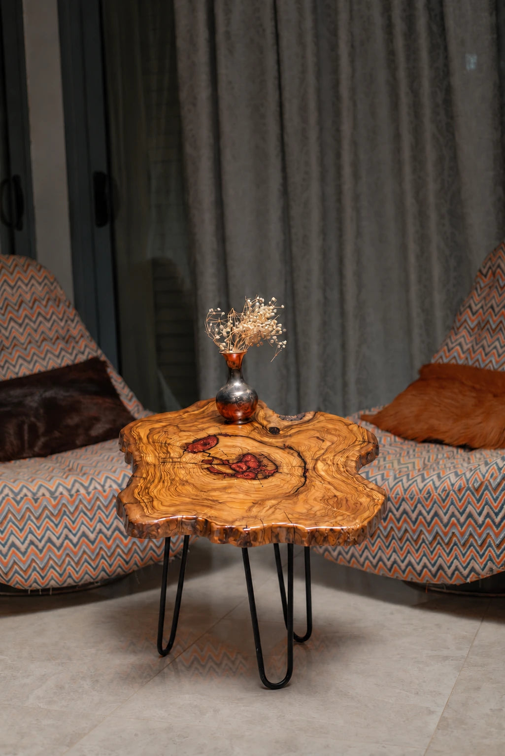 AI-styled view of Zitun Atelier table 023, an olive wood resin side table with copper red resin inlay, in a lounge setting with a vase on the tabletop.