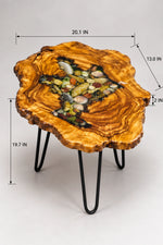 AI-styled view of Zitun Atelier table 047, an olive wood resin side table with sea shell pebble resin, on a light background with measurement annotations.