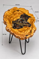 AI-styled view of Zitun Atelier table 053, an olive wood resin side table with pine cone black resin, on a light background with measurement annotations.