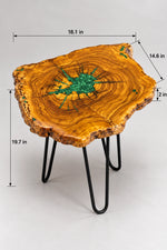 AI-styled view of Zitun Atelier table 054, an olive wood resin side table with green malachite starburst resin, on a light background with measurement annotations.