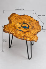 AI-styled view of Zitun Atelier table 065, an olive wood resin side table with blue resin ring, on a light background with measurement annotations.