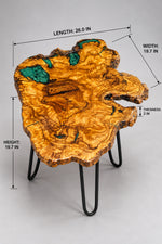 AI-styled view of Zitun Atelier table 068, an olive wood resin small coffee table with emerald green resin edge, on a light background with measurement annotations.