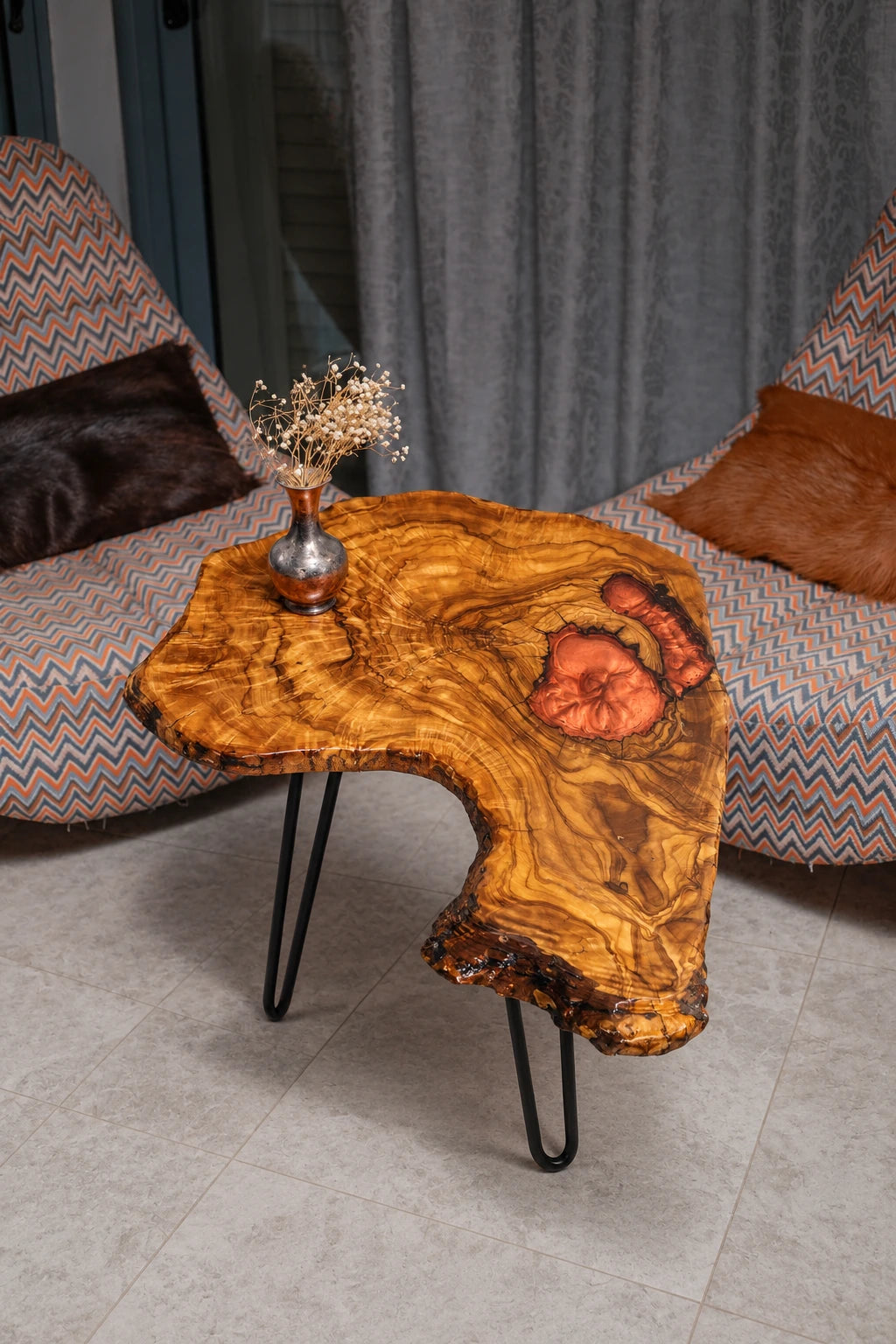 AI-styled view of Zitun Atelier table 088, an olive wood resin side table with copper resin inlay, viewed from above between two upholstered armchairs.