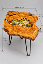 AI-styled view of Zitun Atelier table 093, an olive wood resin side table with sea shell pebble resin, on a light background with measurement annotations.