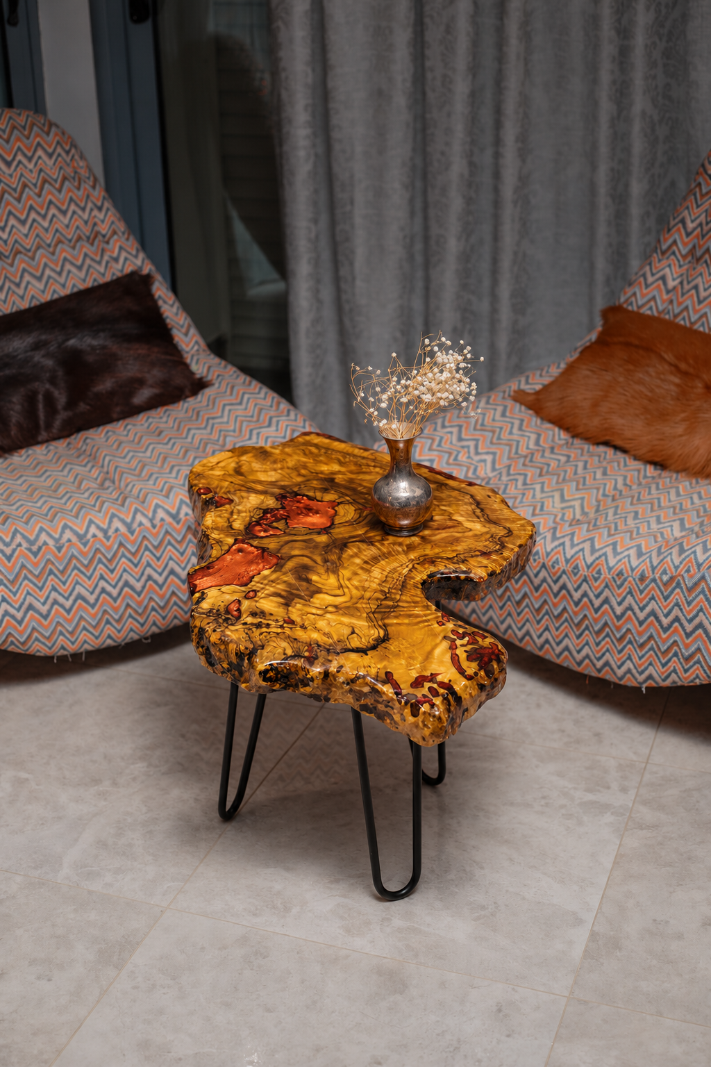AI-styled view of Zitun Atelier table 098, an olive wood resin side table with copper resin burl, viewed from above between two upholstered armchairs.