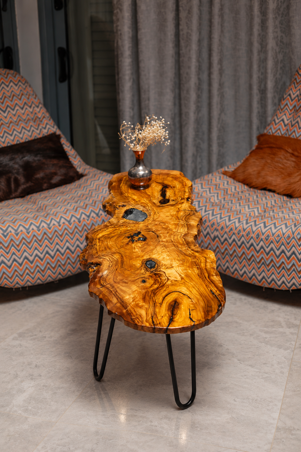 AI-styled view of Zitun Atelier table 099, an olive wood resin small coffee table with black resin knots, in a lounge setting with a vase on the tabletop.